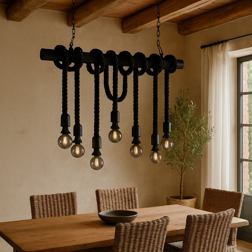 Dining room with wooden table and chairs, featuring a unique chandelier.