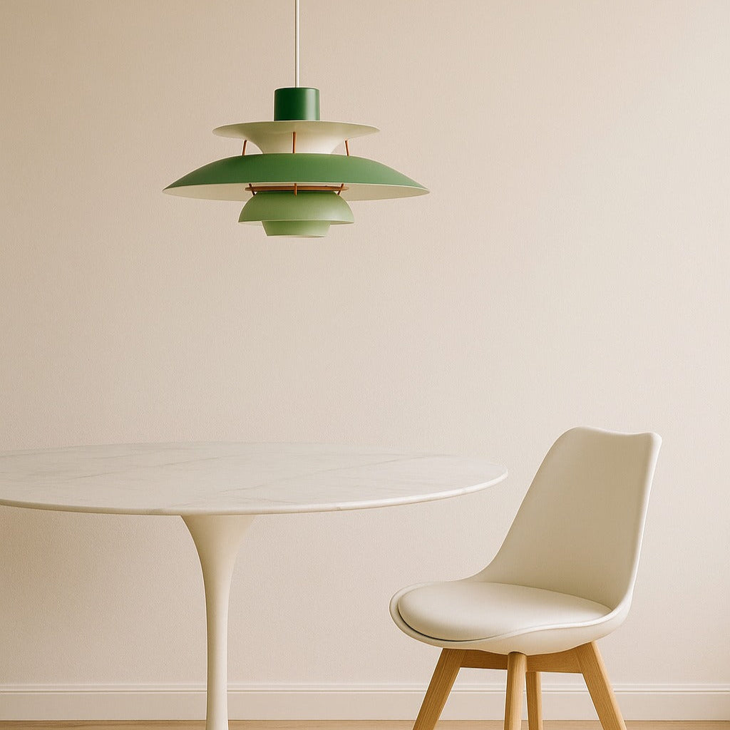 Green pendant lamp hanging above a white round table with a beige chair.